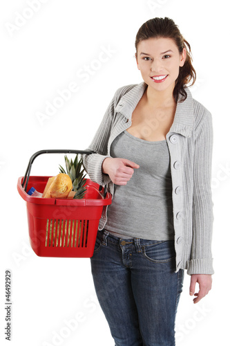 Photo: Happy woman with shopping basket Happy woman with shopping basket