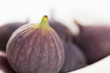 Close up of figs on white background.