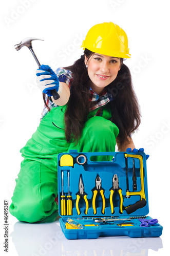 Photo: Woman with toolkit on white Woman with toolkit on white