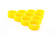 Photo: Yellow plastic bottle caps isolated on white background Yellow plastic bottle caps isolated on white background