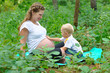 The boy touches a stomach of pregnant mother