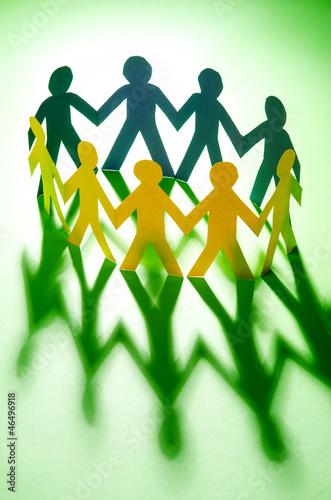 Photo: Paper people in teamworking concept Paper people in teamworking concept