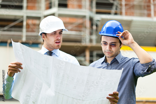 Photo: Couple of engineers at building site Couple of engineers at building site