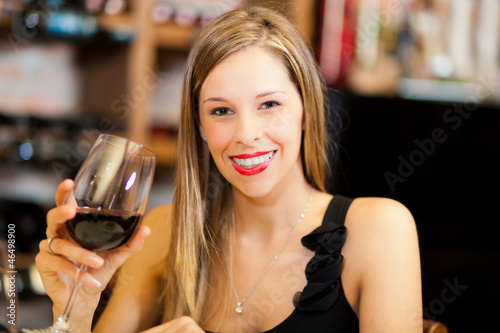 Photo: Young woman tasting wine Young woman tasting wine