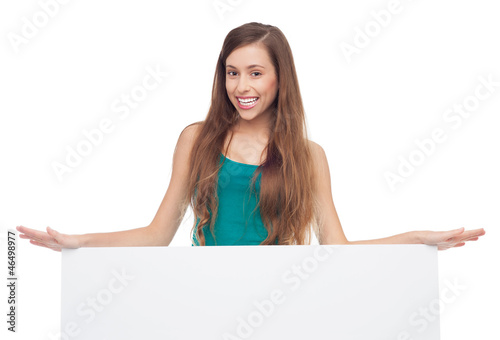 Photo: Attractive woman with blank poster Attractive woman with blank poster