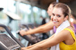 Running on treadmill in gym or fitness club