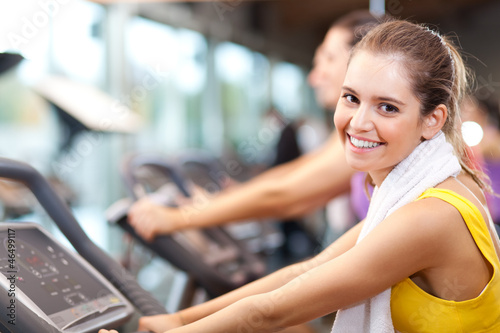 Photo: Running on treadmill in gym or fitness club Running on treadmill in gym or fitness club