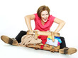 Pretty woman packs her overcrowded bag for holidays