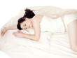 Sleeping young woman - isolated