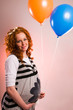 Photo: Beautiful pregnant woman holding balloons Beautiful pregnant woman holding balloons