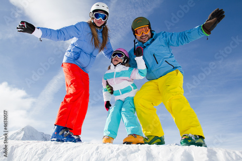 Photo: Ski, snow, sun and winter fun - happy family ski team Ski, snow, sun and winter fun - happy family ski team
