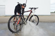 man washing the bike