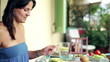 Happy, attractive couple eating breakfast together on the terrac