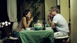 Young couple drinking wine on the balcony in the evening 