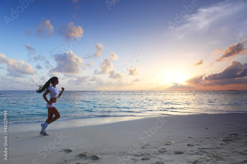 Photo: Woman running on beach Woman running on beach
