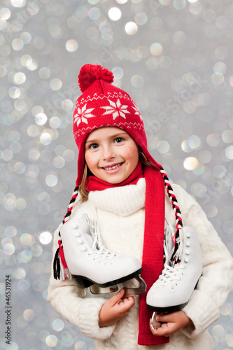 Photo: Ice skating - cute girl with ice skating boots Ice skating - cute girl with ice skating boots