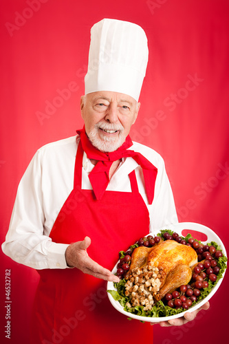 Photo: Experienced Chef Holding Holiday Dinner Experienced Chef Holding Holiday Dinner