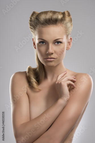 Photo: portrait of naked blonde girl with arm on the chest portrait of naked blonde girl with arm on the chest
