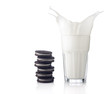 Splash of milk with various chocolate cookies