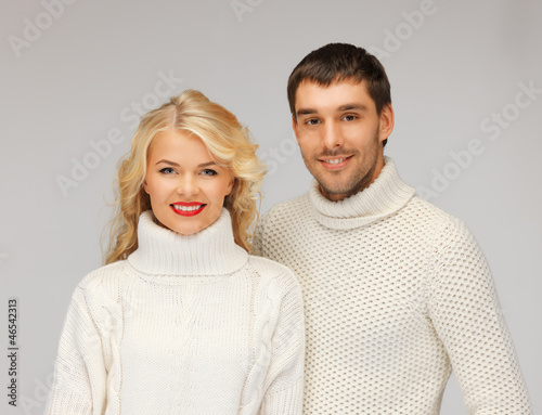 Photo: family couple in a sweaters family couple in a sweaters