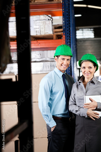 Photo: Supervisors With Digital Tablet At Warehouse Supervisors With Digital Tablet At Warehouse