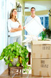 Happy couple moving in a new house.
