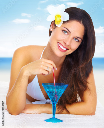 Photo: Beautiful woman in bikini on the beach. Beautiful woman in bikini on the beach.