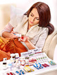 Woman having pills and tablets.