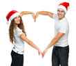 Beautiful Christmas couple in Santa hats