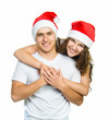 Beautiful Christmas couple in Santa hats