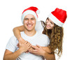 Beautiful Christmas couple in Santa hats