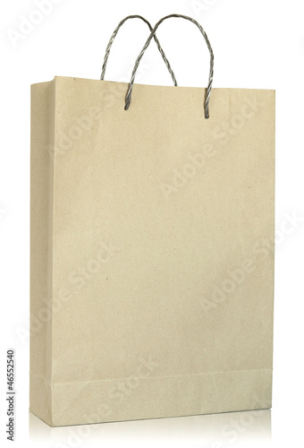 Photo: Brown paper bag isolated on white background Brown paper bag isolated on white background