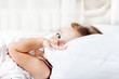 Toddler hiding behind  pillow