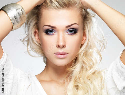 Photo: Beautiful blond woman with saturated makeup. Beautiful blond woman with saturated makeup.