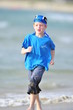 Boy running on the beach