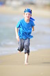 Boy running on the beach