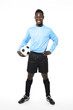 Smiling african american soccer player holding soccer ball