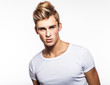 Elegant young handsome man. Studio fashion portrait.