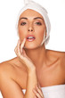 Beautiful woman applying lip gloss