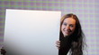 girl holding a white banner in her hands