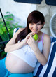 Photo: portrait of pretty young woman expecting a baby,outdoors, portrait of pretty young woman expecting a baby,outdoors,