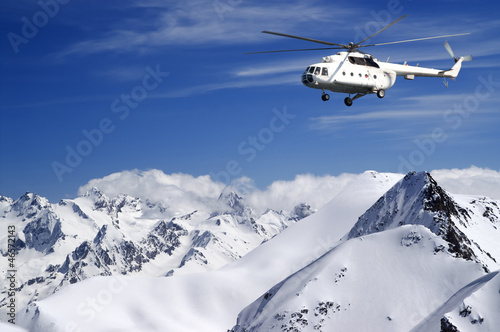 Photo: Helicopter in winter mountains Helicopter in winter mountains