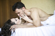 Photo: Young lovers lay in bed Young lovers lay in bed