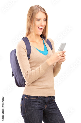 Photo: Excited female holding mobile phone Excited female holding mobile phone