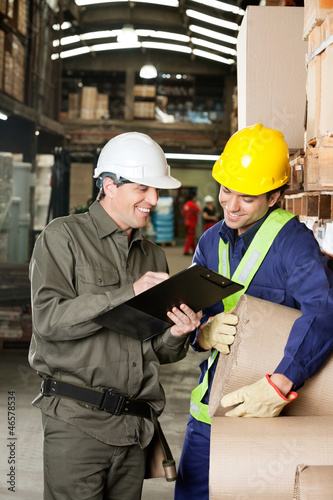 Photo: Supervisor Showing Clipboard To Foreman Supervisor Showing Clipboard To Foreman