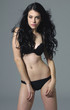 stunning woman wearing lingerie on gray background