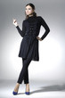 full-length,young pretty woman in black dress posing