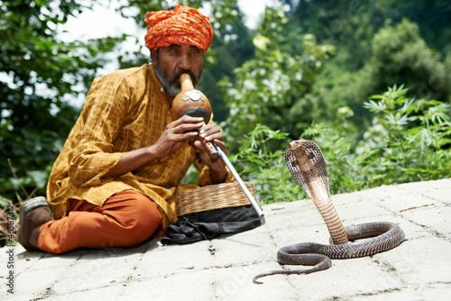 Photo: charmer of snake in India charmer of snake in India
