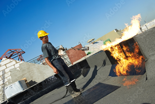 Photo: Flat roof covering repair works with roofing felt Flat roof covering repair works with roofing felt