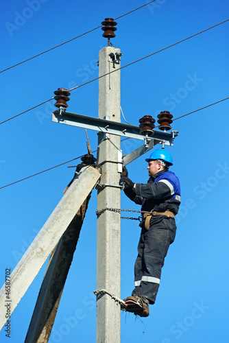 Photo: power electrician lineman at work on pole power electrician lineman at work on pole